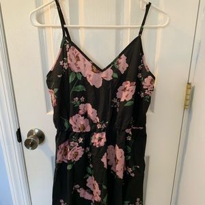 Black romper with floral design. Shein size large.